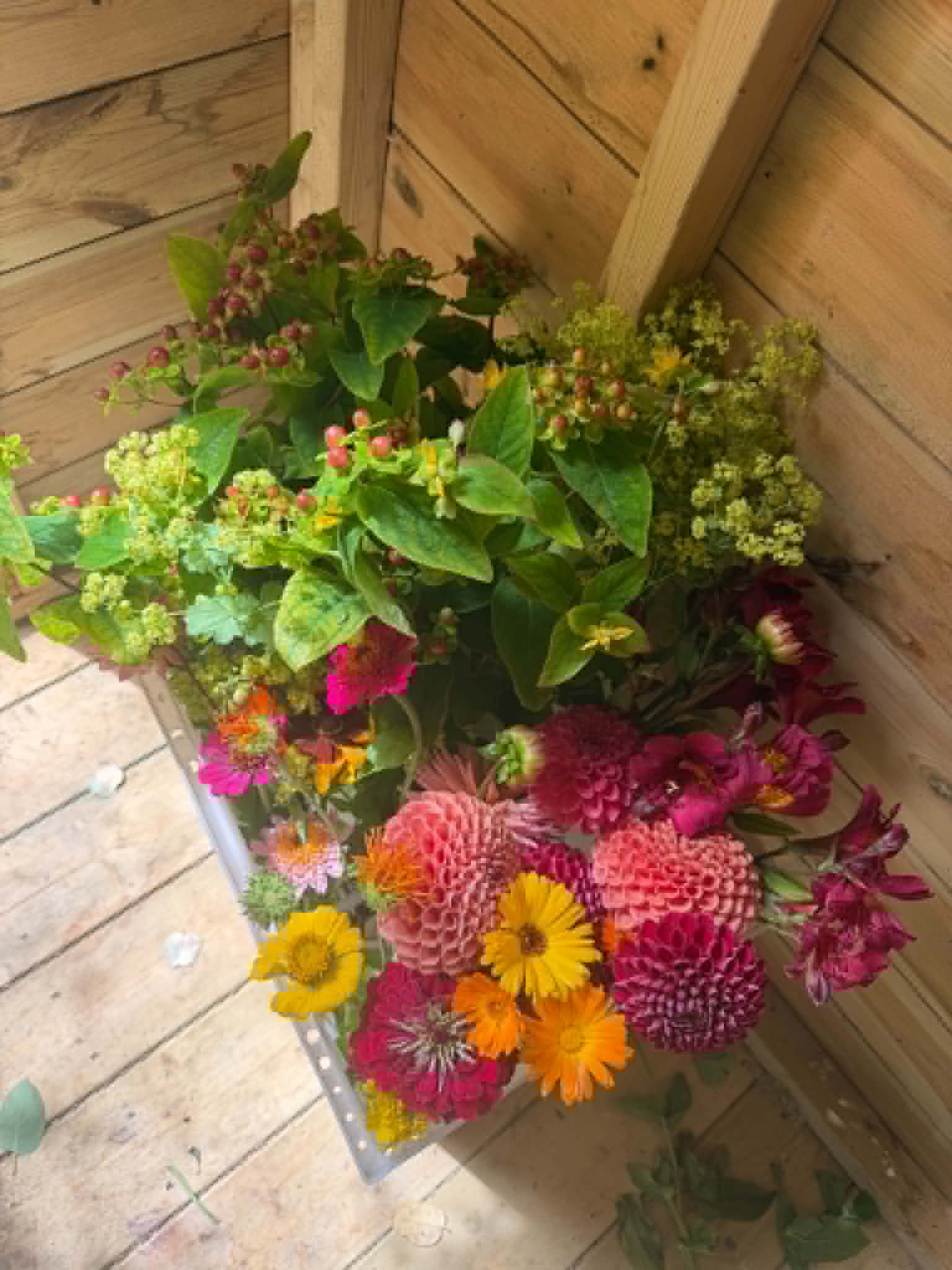 Bouquet with autumn berries in the corner of the shed