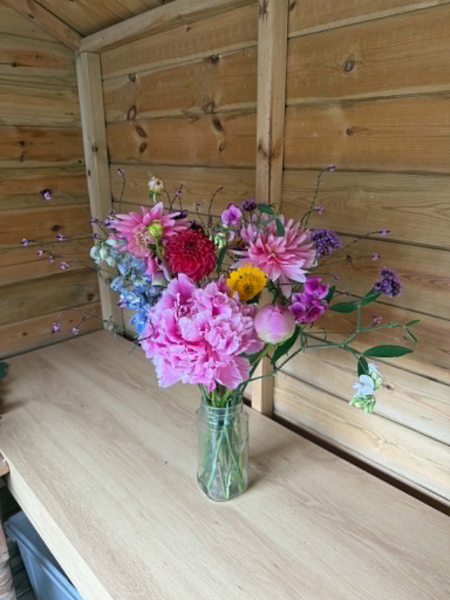 Bouquet arranged in a vase inside the shed